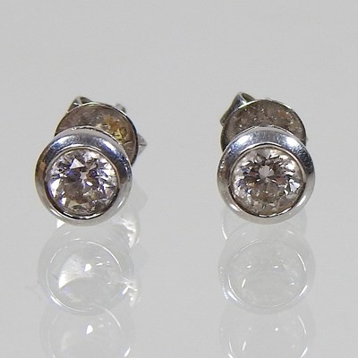 Lot 113 - A pair of 18 carat gold diamond stud earrings