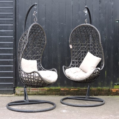 Lot 303 - A pair of rattan hanging garden chairs, with loose cushions