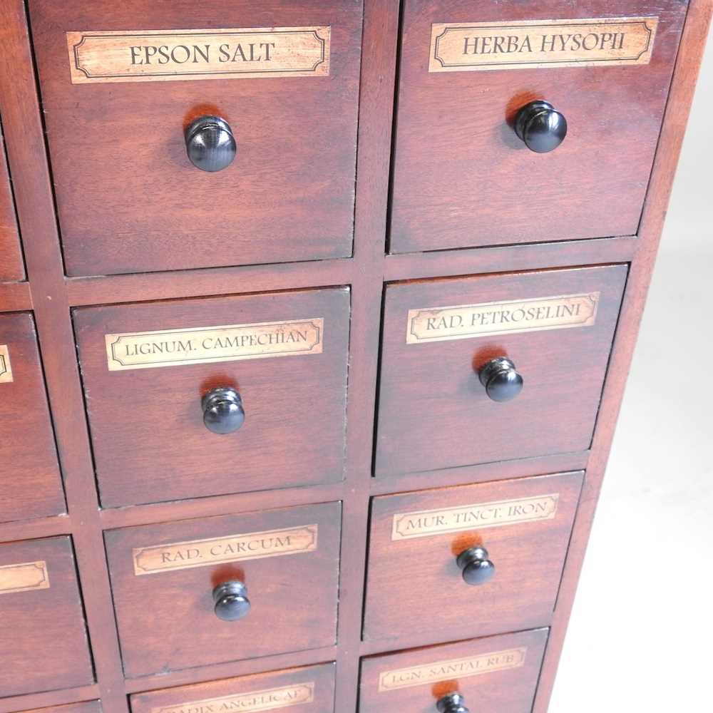 Lot 147 A mahogany apothecary