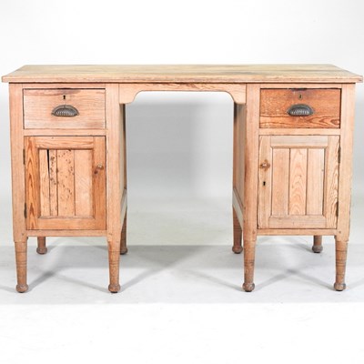 Lot 497 - A pine pedestal desk