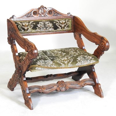 Lot 95 - An early 20th century continental carved oak armchair