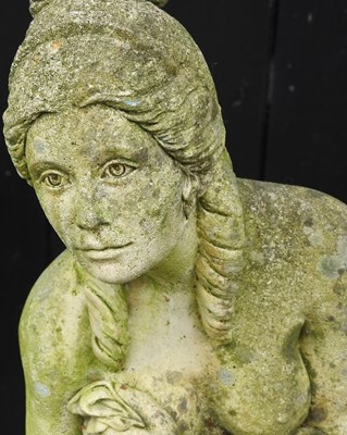 Lot 55 - A cast stone garden statue