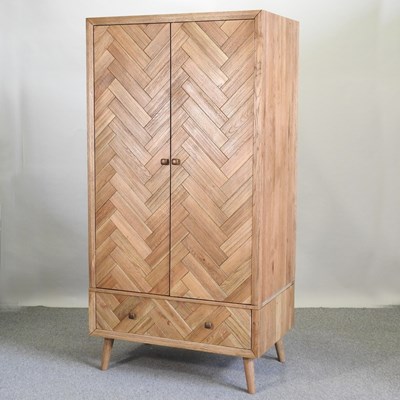 Lot 675 - A modern light oak wardrobe