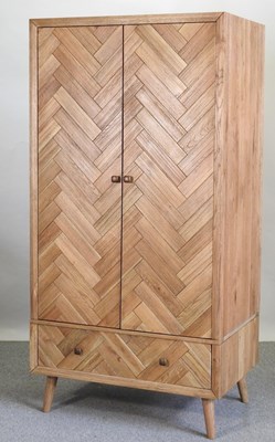 Lot 675 - A modern light oak wardrobe