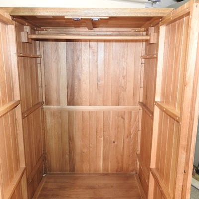 Lot 675 - A modern light oak wardrobe