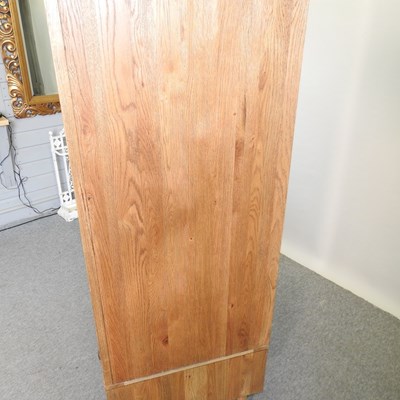 Lot 675 - A modern light oak wardrobe