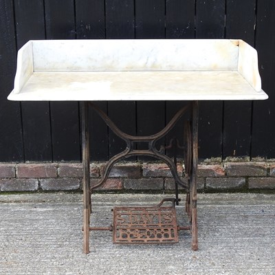 Lot 885 - A garden table