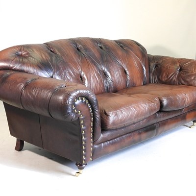 Lot 198 - A brown leather sofa