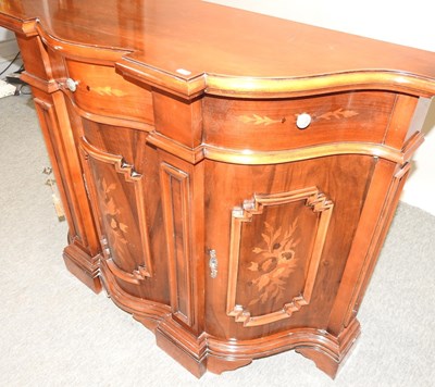 Lot 607 - An Italian reproduction serpentine credenza