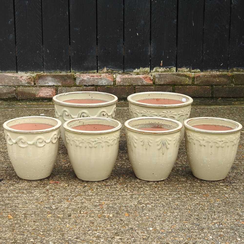 Lot 931 Six cream glazed garden pots