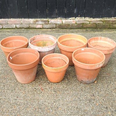 Lot 656 - A set of six terracotta pots and another