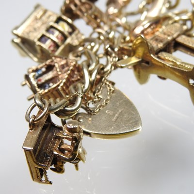 Lot 4 - A 9 carat gold charm bracelet
