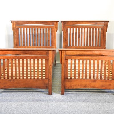 Lot 697 - A pair of modern hardwood single bedsteads