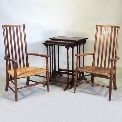 Lot 902 - Two rush seated armchairs and a table