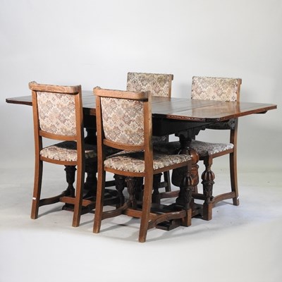 Lot 677 - A draw leaf table and chairs