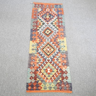 Lot 489 - A kilim runner