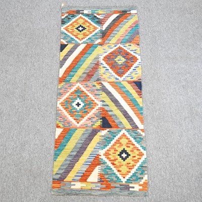 Lot 633 - A kilim runner