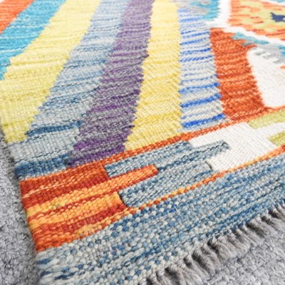 Lot 633 - A kilim runner