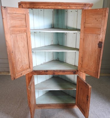 Lot 592 - An antique pine corner cupboard