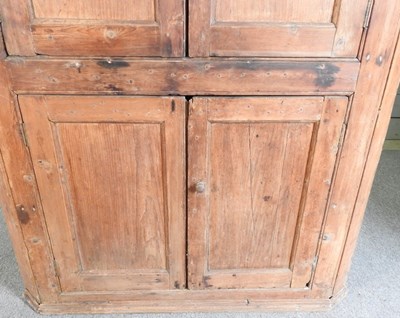 Lot 592 - An antique pine corner cupboard