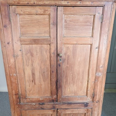 Lot 592 - An antique pine corner cupboard