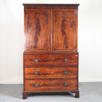 Lot 495 - A George III secretaire cabinet