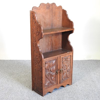 Lot 206 - A Victorian carved oak cabinet