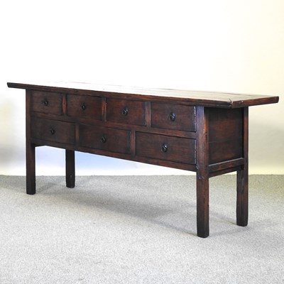 Lot 656 - A Chinese elm dresser base