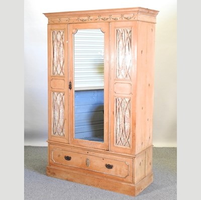 Lot 466 - An Edwardian stripped pine single wardrobe