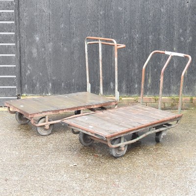 Lot 22 - Two flat bed trolleys, together with another