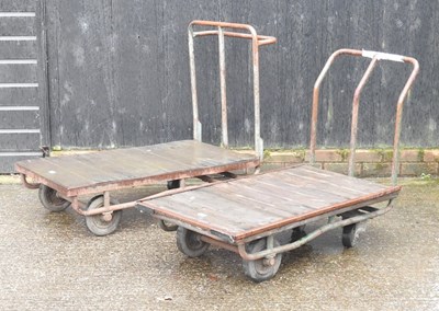 Lot 22 - Two flat bed trolleys, together with another
