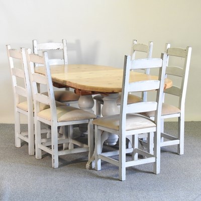 Lot 864 - A modern painted and pine extending dining...