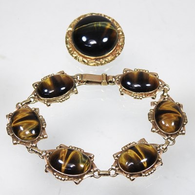 Lot 239 - A gold and tiger's eye bracelet and brooch