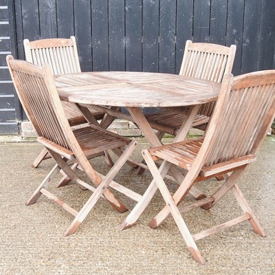 Lot 26 - A teak folding garden table and chairs