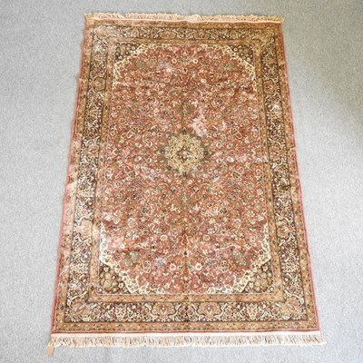 Lot 643 - A Persian silk rug