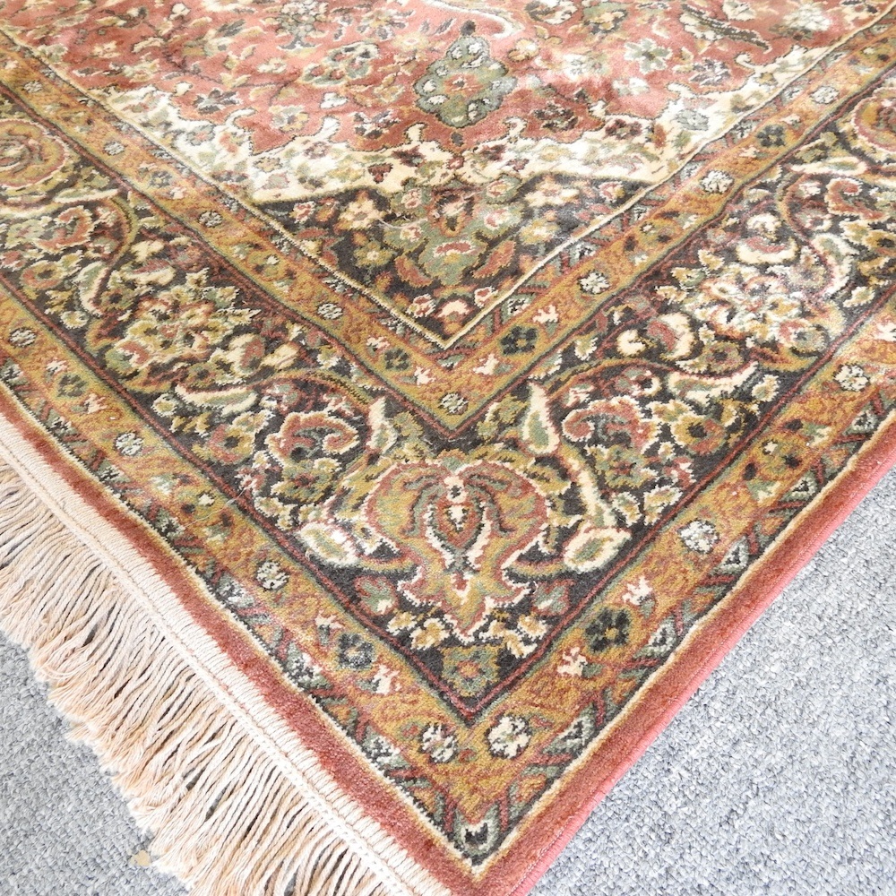 Lot 643 A Persian silk rug