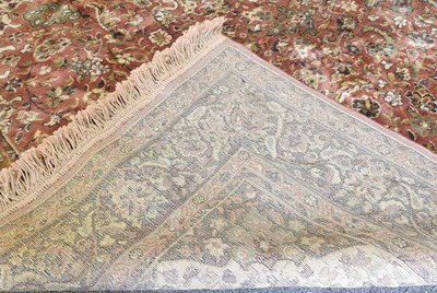 Lot 643 - A Persian silk rug