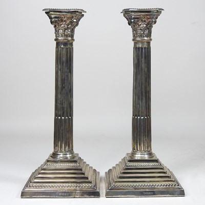 Lot 23 - A pair of silver candlesticks