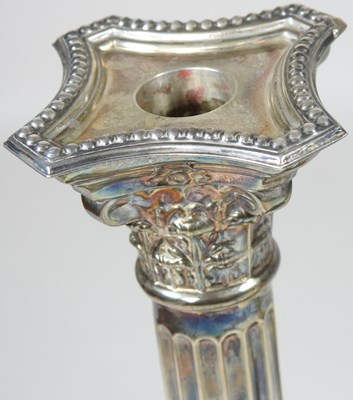 Lot 23 - A pair of silver candlesticks