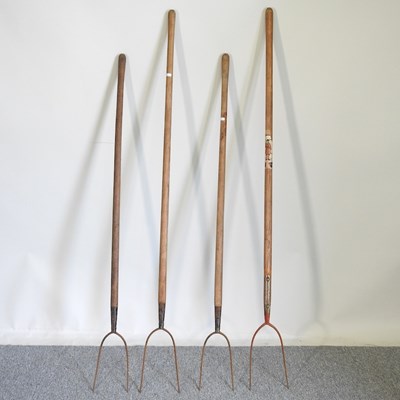 Lot 440 - A collection of four pitchforks