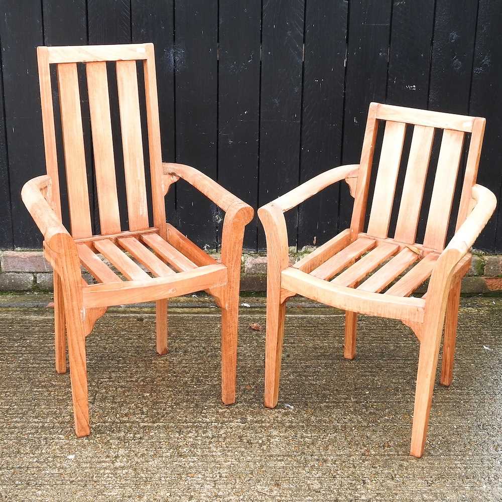 Lot 448 A pair of teak garden chairs