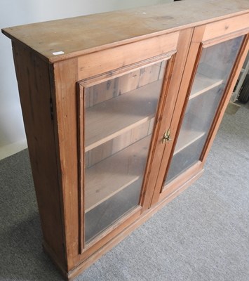 Lot 612 - An antique pine glazed bookcase