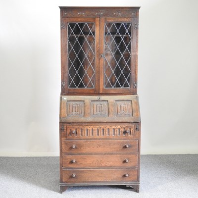 Lot 707 - An Old Charm style bureau bookcase