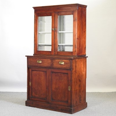 Lot 398 - A 19th century stained pine cabinet bookcase