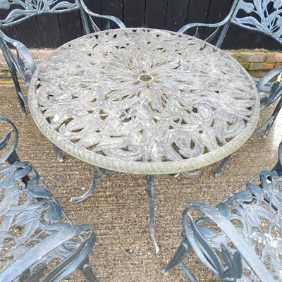 Lot 619 - A green painted metal garden table and chairs