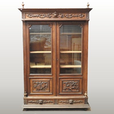 Lot 430 - A 19th century French oak vitrine