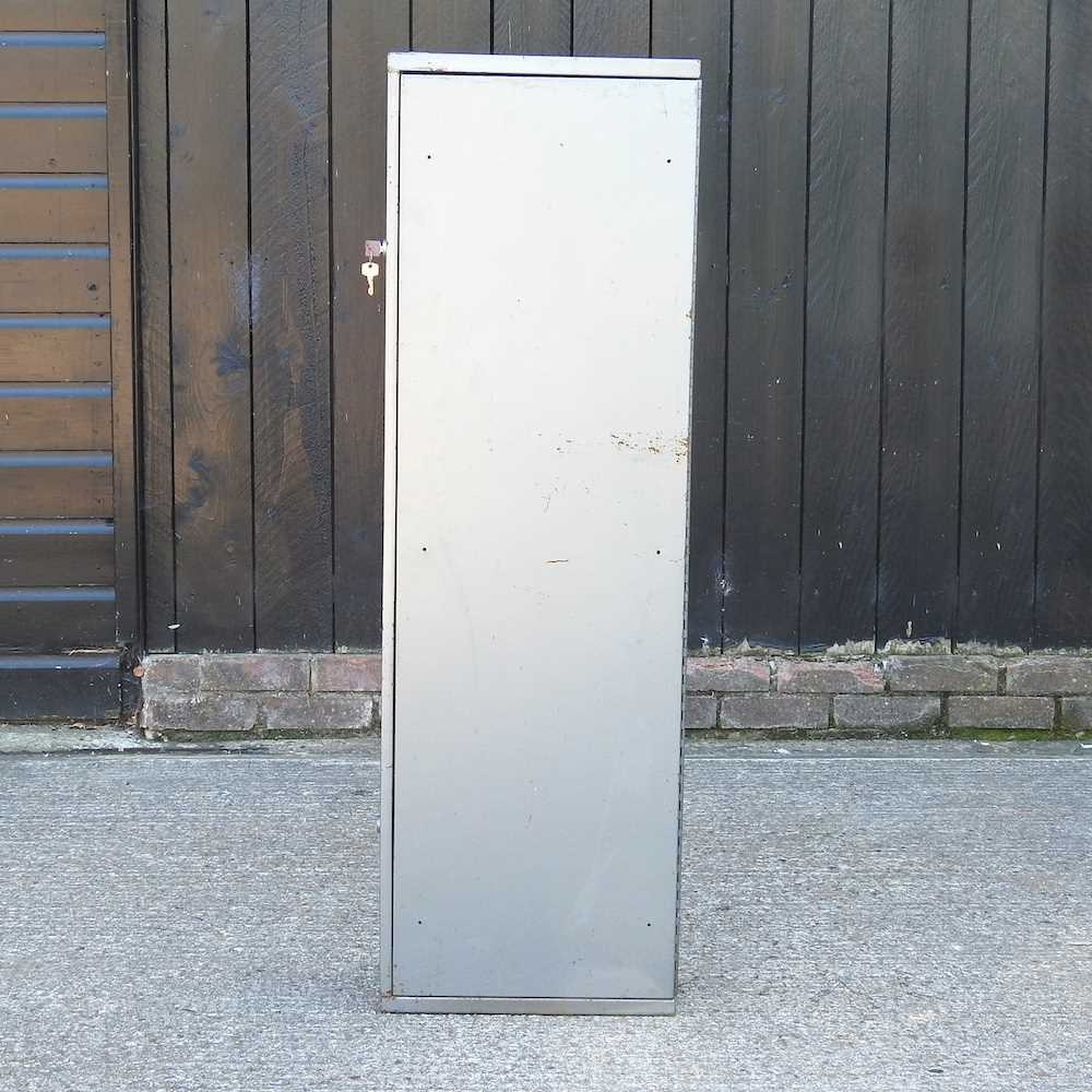 Lot 655 - A metal gun cabinet