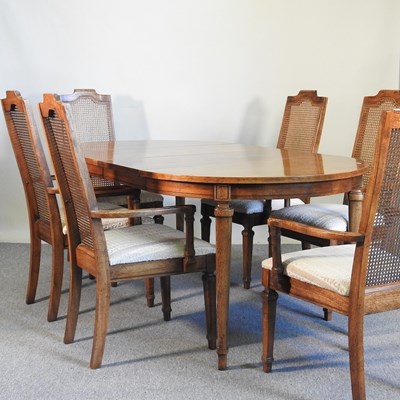 Lot 345 - A walnut dining suite