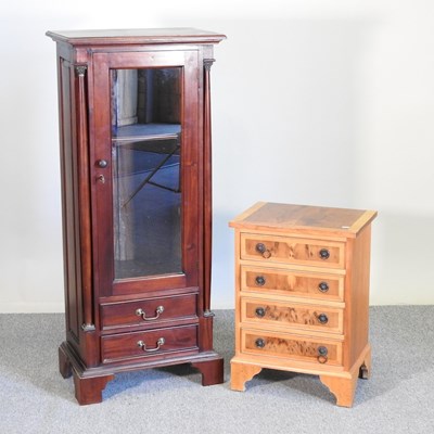 Lot 342 - A hardwood cabinet and chest