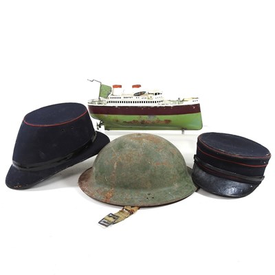 Lot 425 - A World War II helmet and two French hats